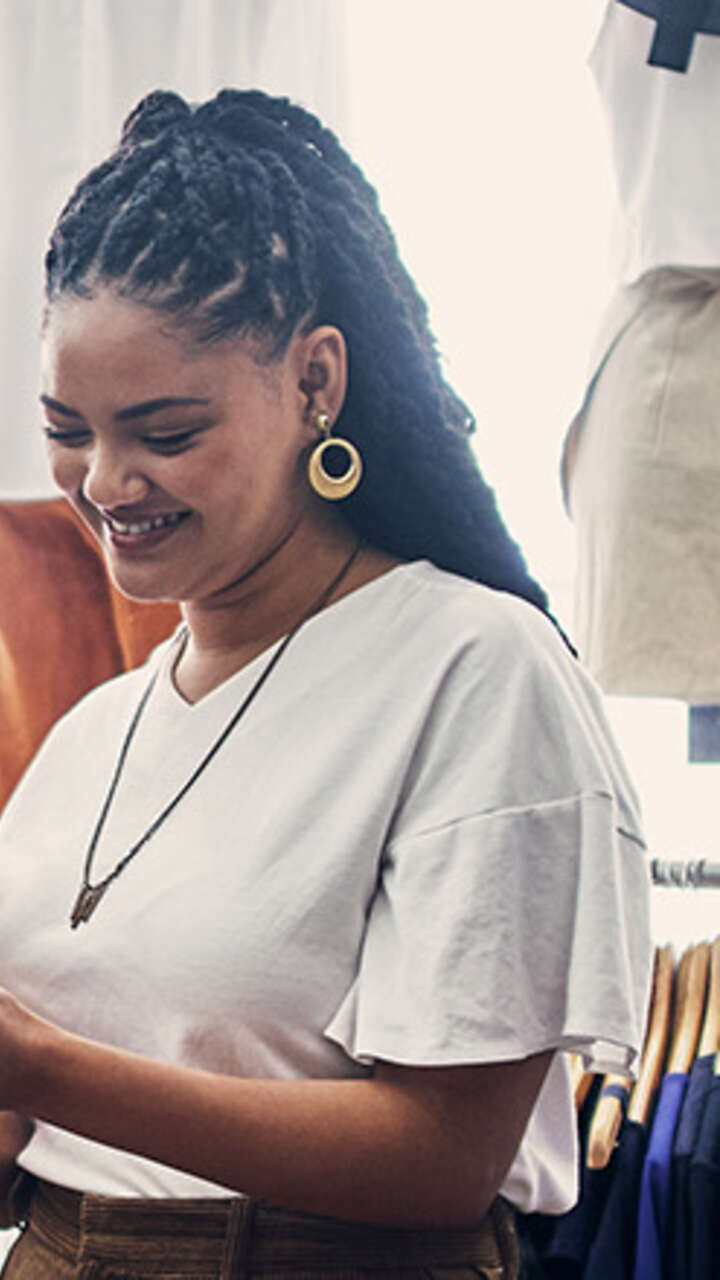 Two females smiling in retail shop