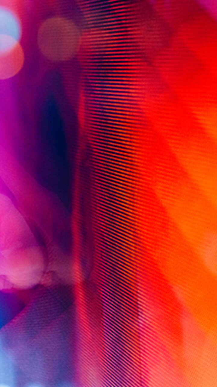 close-up of female hand touching illuminated digital screen
