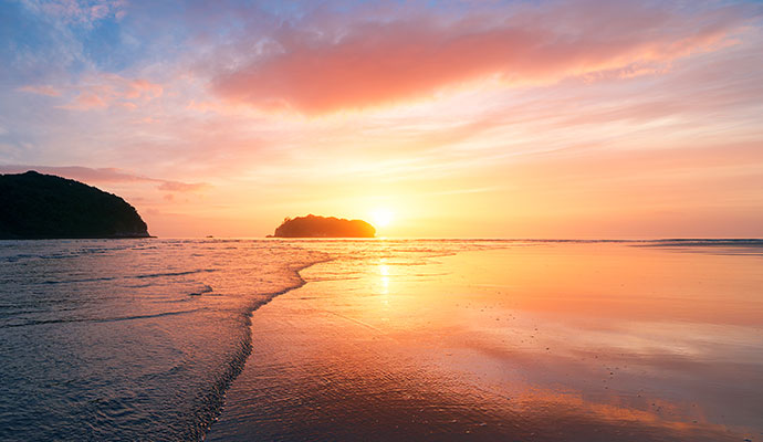 sunrise over beach at dawn